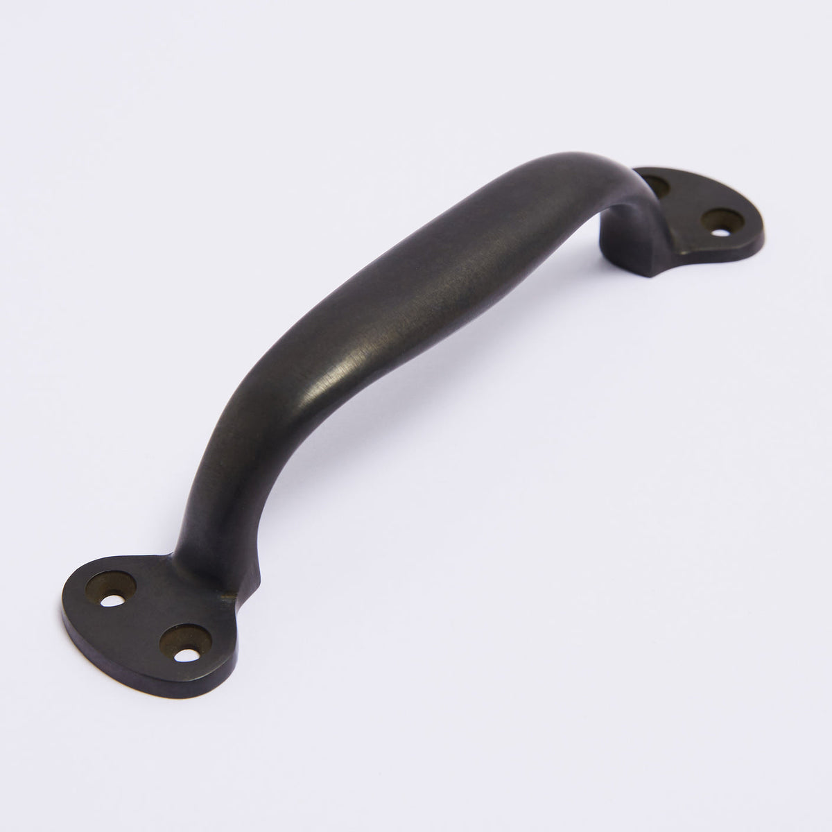 Highland Handle in scorched black fitted to cabinetry