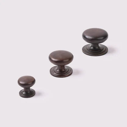 Kew Knob in antique bronze fitted to cabinetry