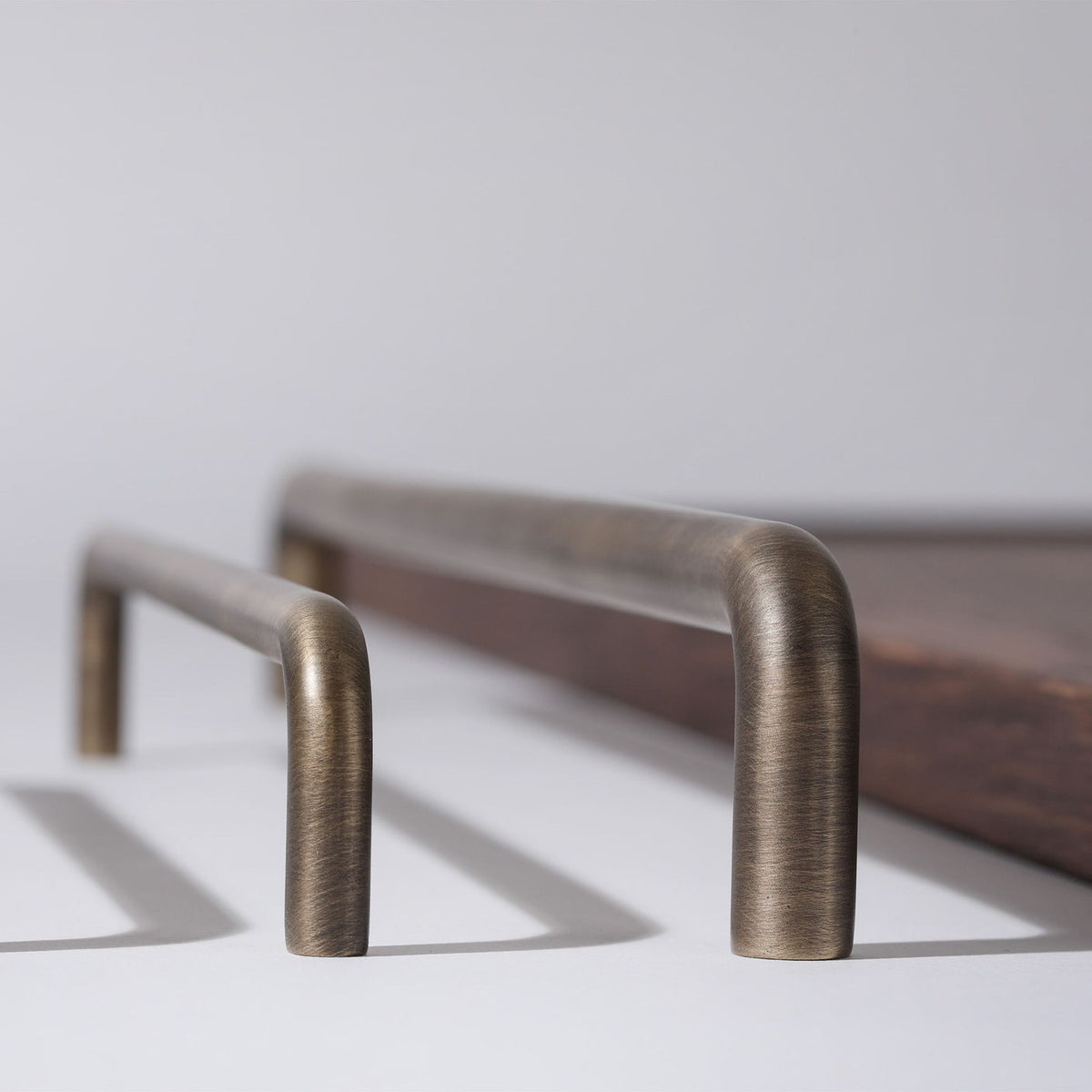 Ren Appliance Pull in English bronze fitted to cabinetry