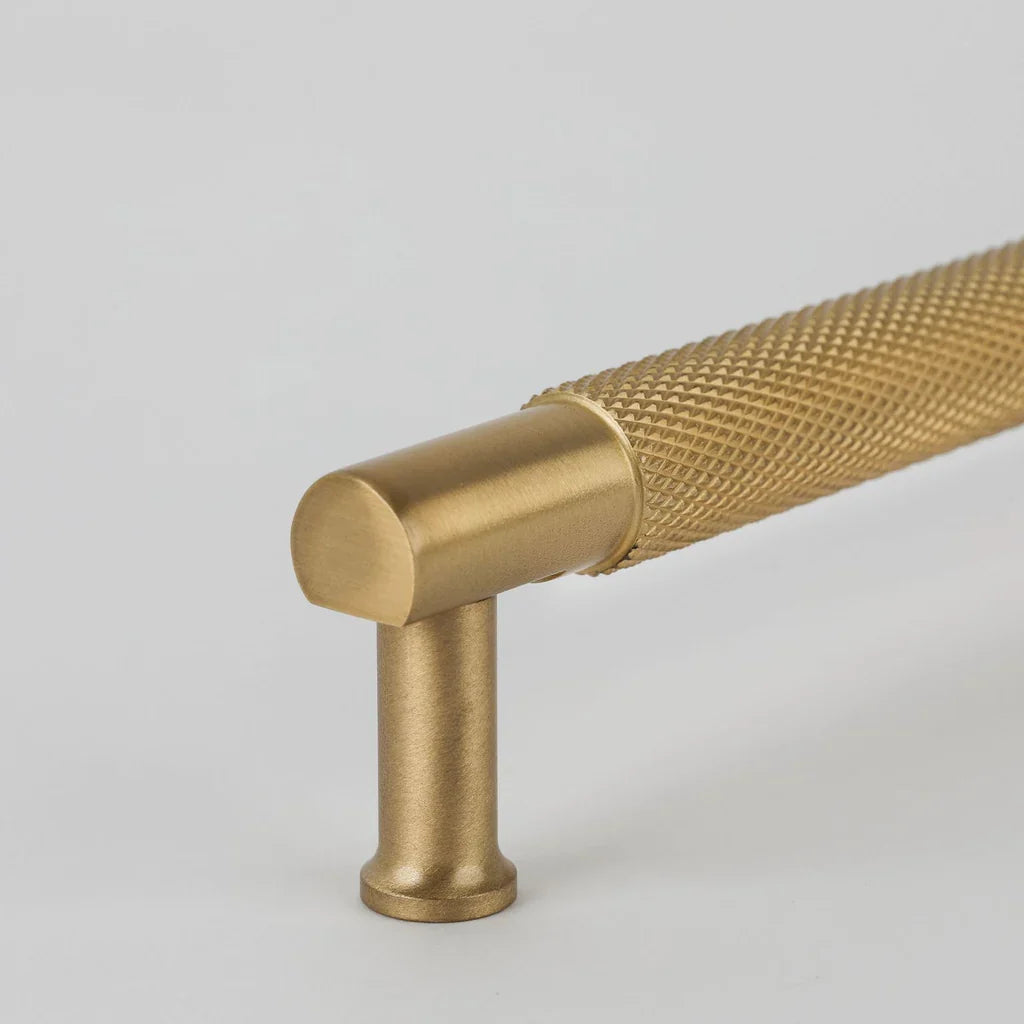 New Yorker knurled texture detail in burnished brass