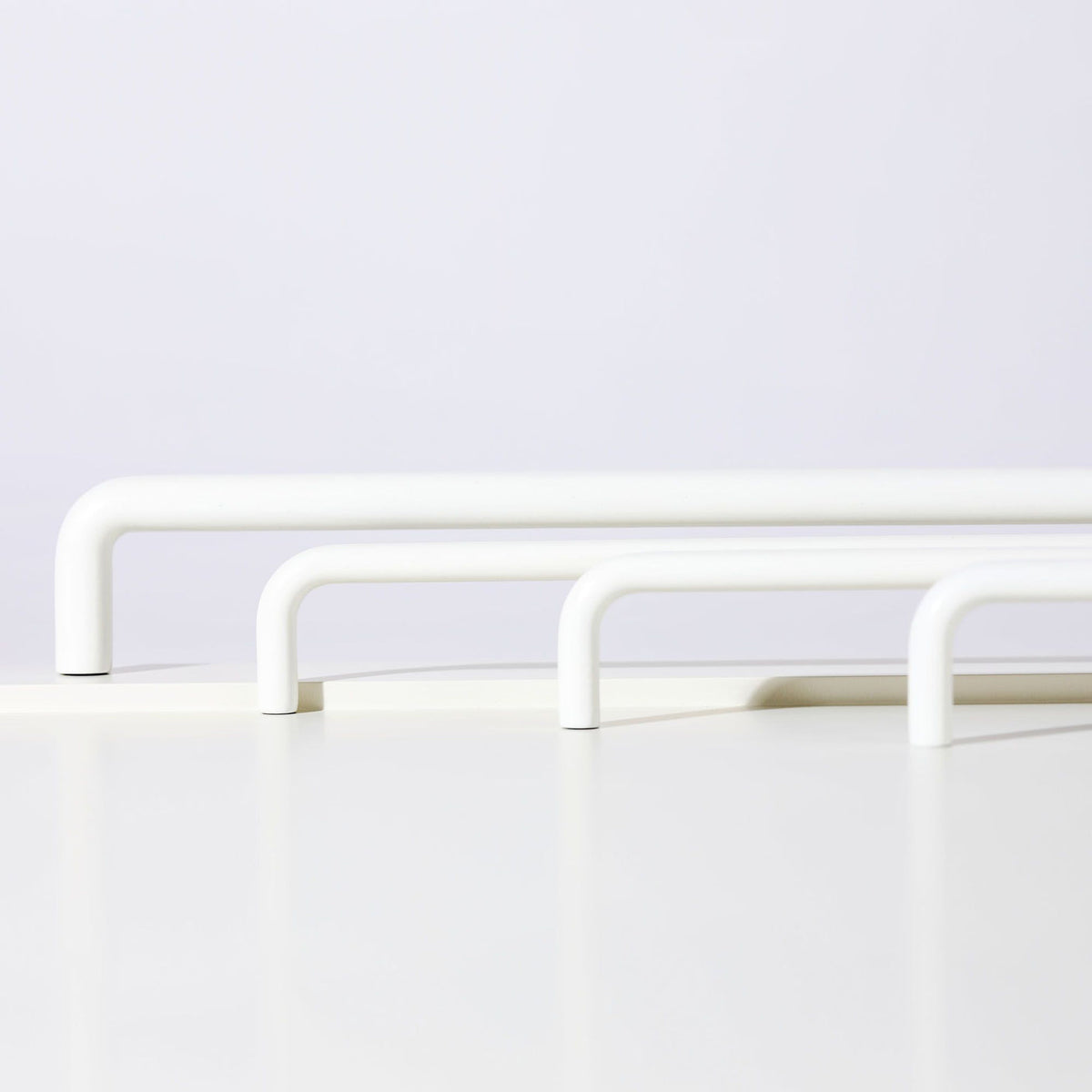 Ren Appliance Pull in white fitted to cabinetry