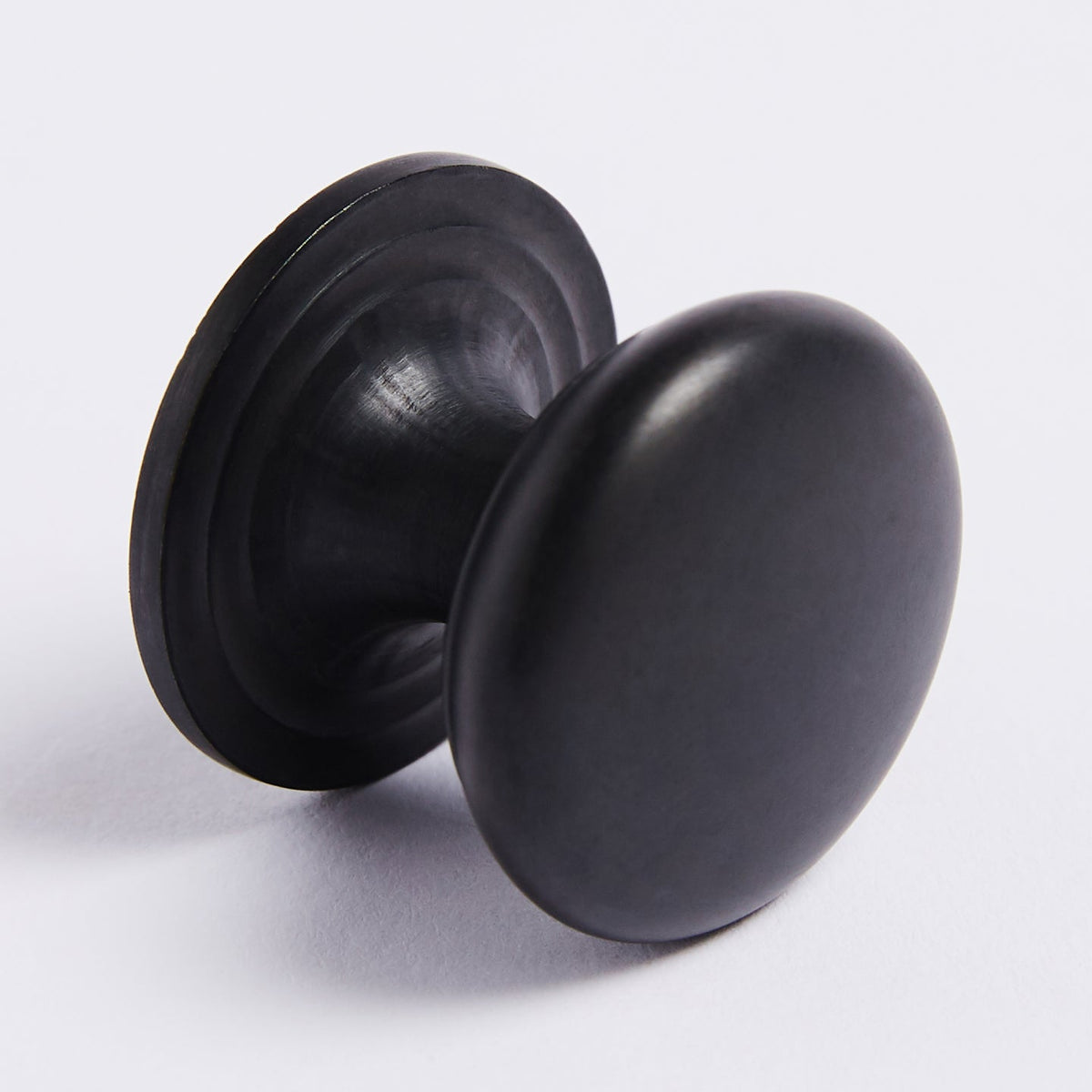 Kew Knob in scorched black fitted to cabinetry