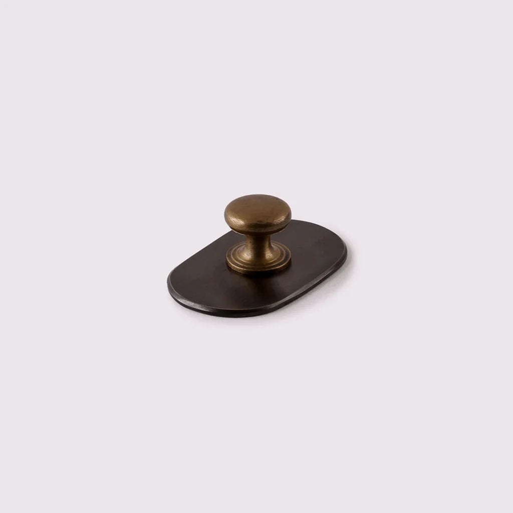 Curved Knob Backplate in antique bronze by Hepburn Hardware