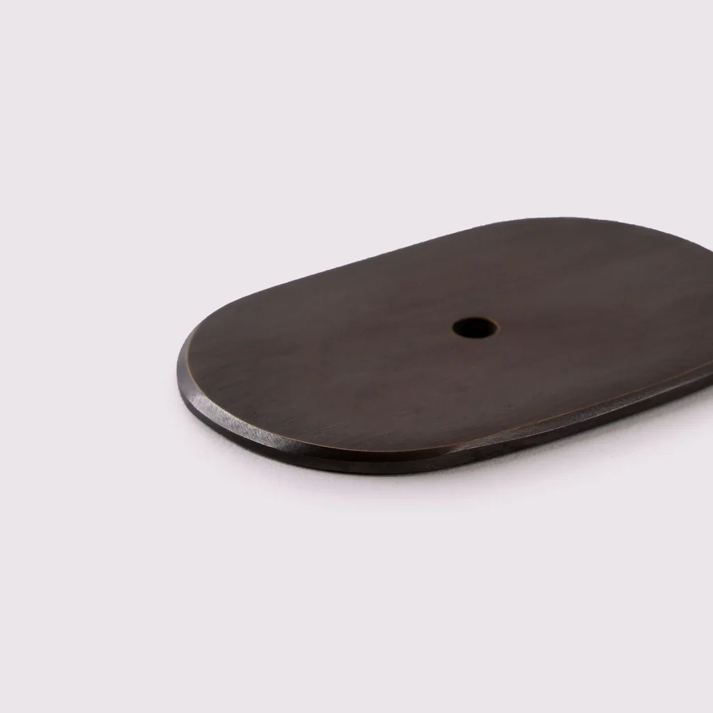 Curved Knob Backplate in antique bronze, detail