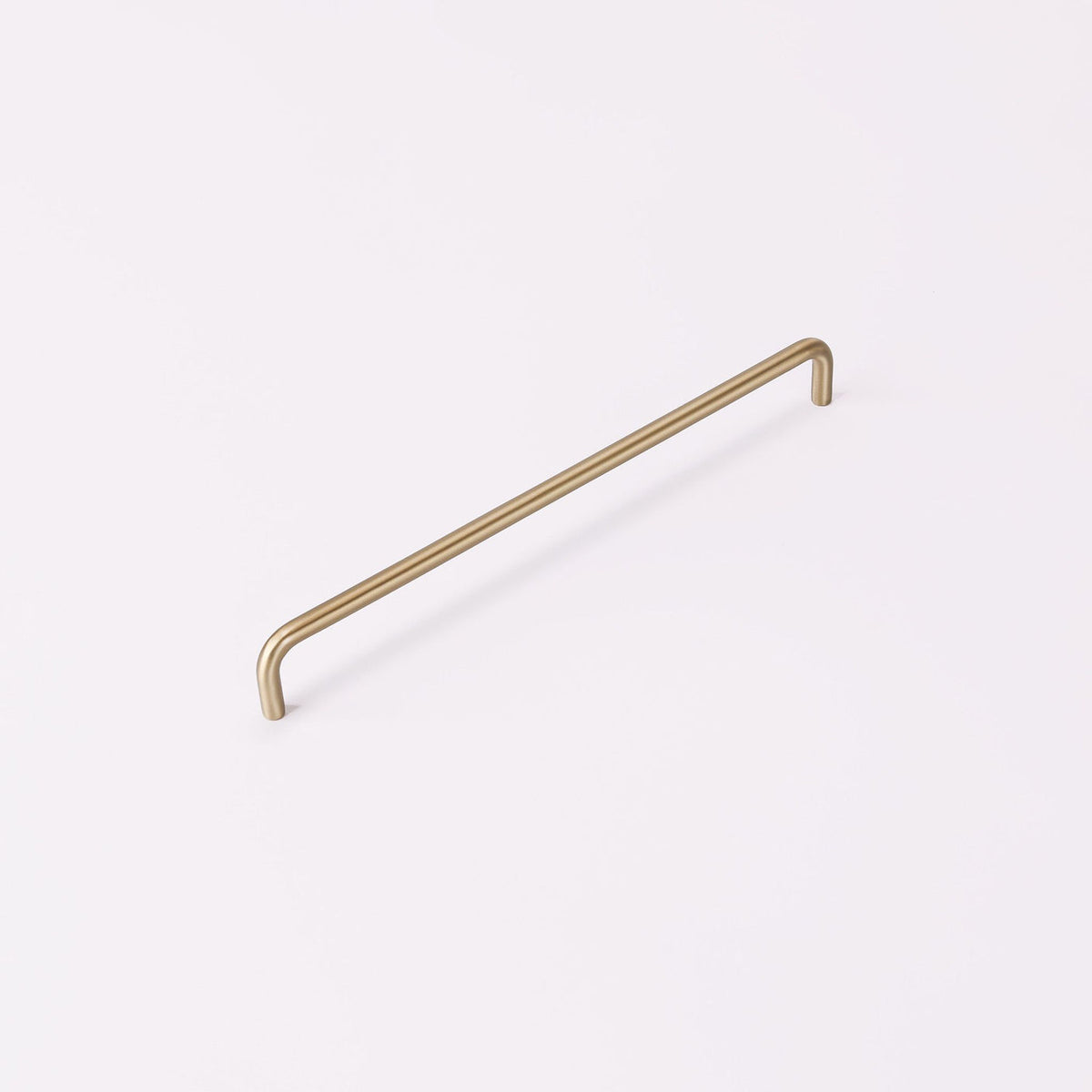 Ren Handle in burnished brass fitted to cabinetry
